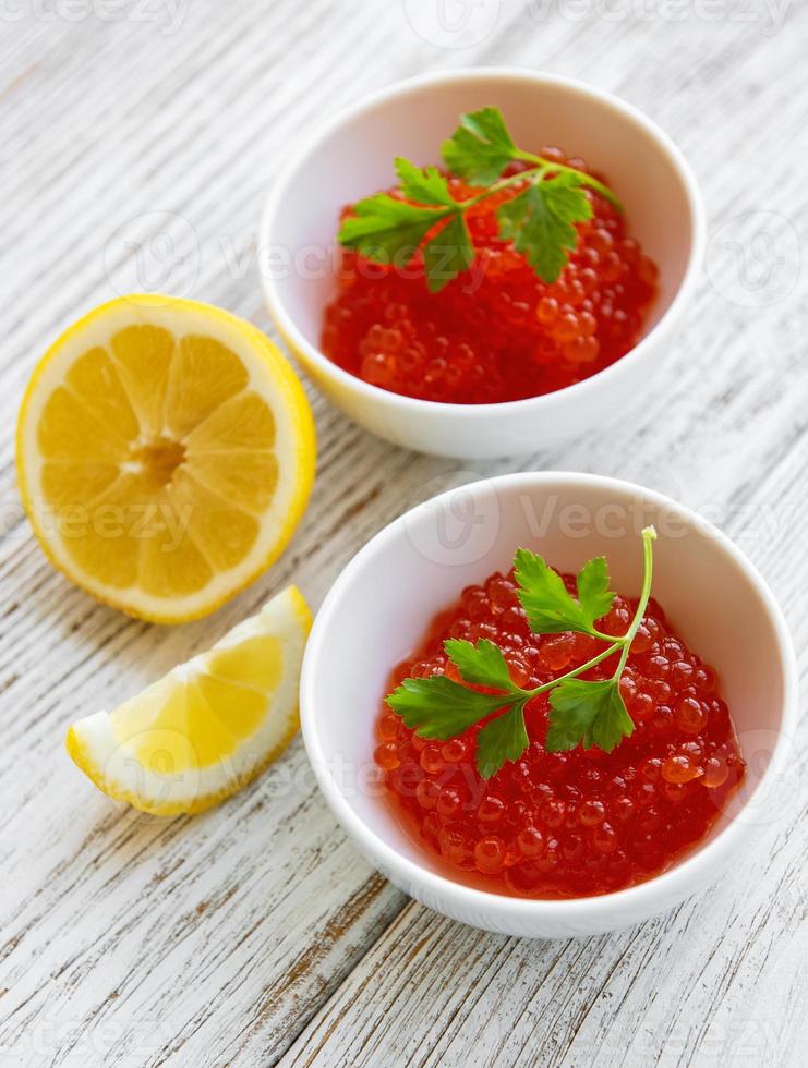 Red caviar in bowls photo