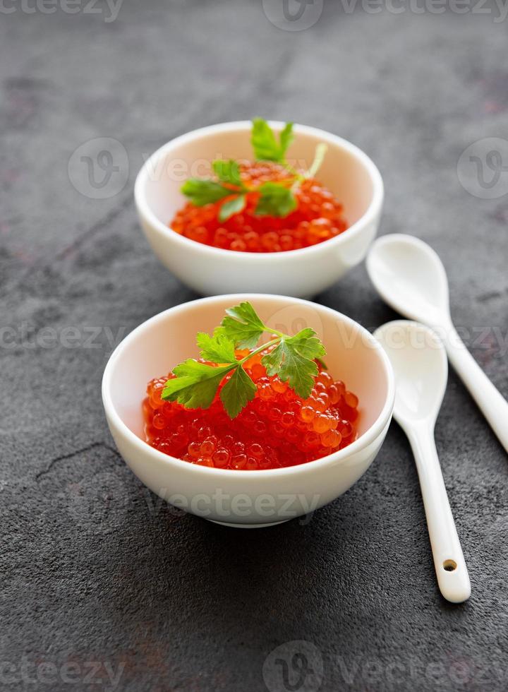 Red caviar in bowls photo