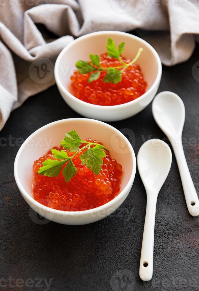 Red caviar in bowls photo