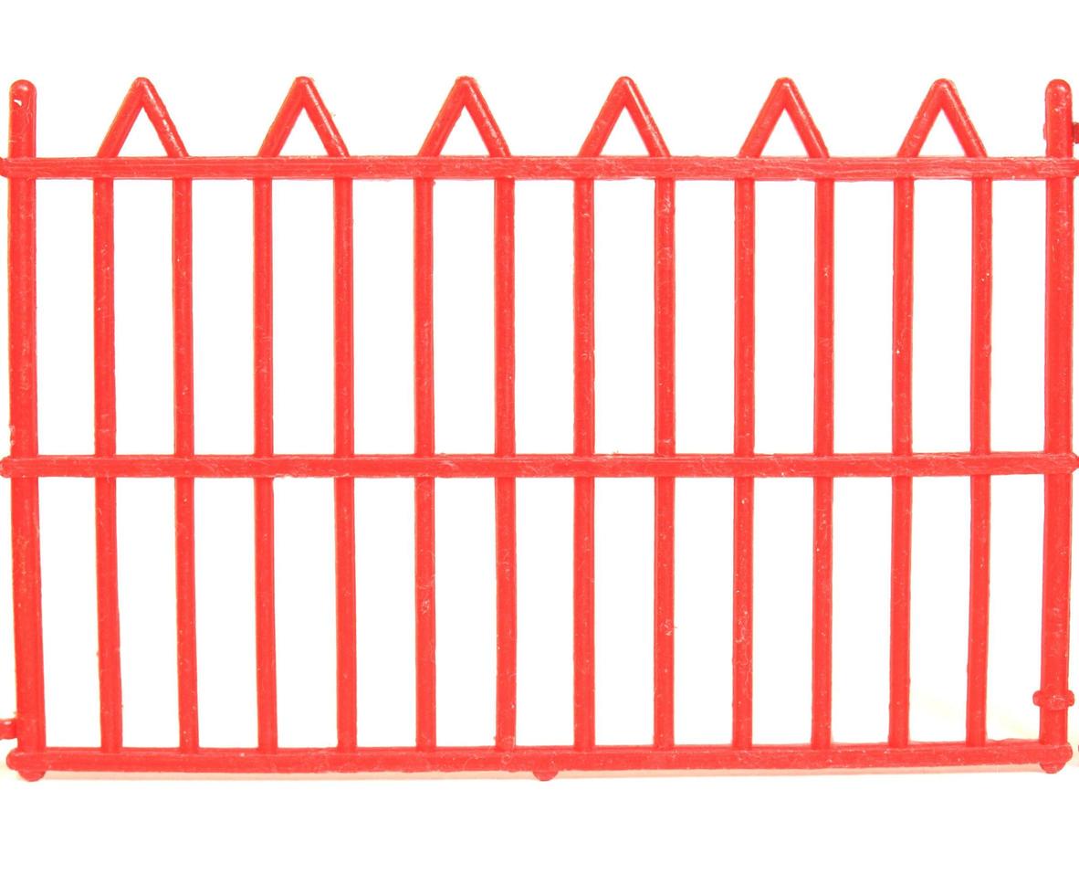 Red plastic fence isolated over white photo