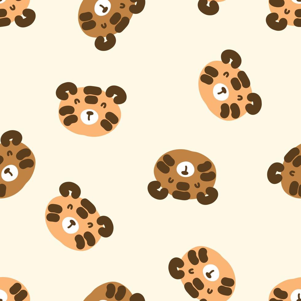 Hand drawn seamless pattern with cute tiger faces. vector