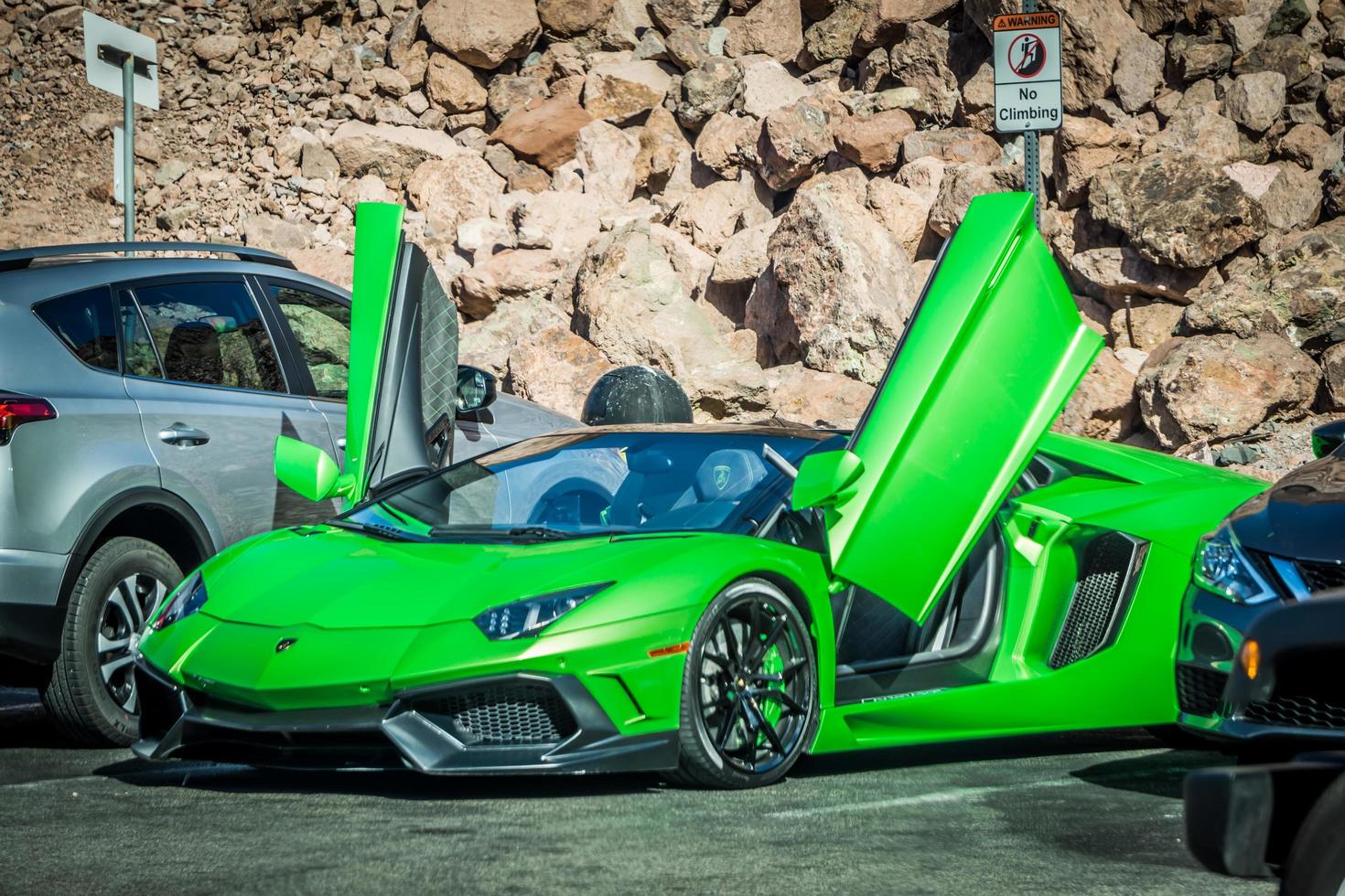 Green Italian Lamborghini car in parking lot at Hoover Dam photo