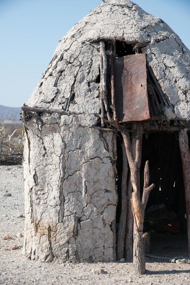 House of Himba tribe, in Kunene region, Namibia. Houses are made of earth and dung by the himba women.Green building photo