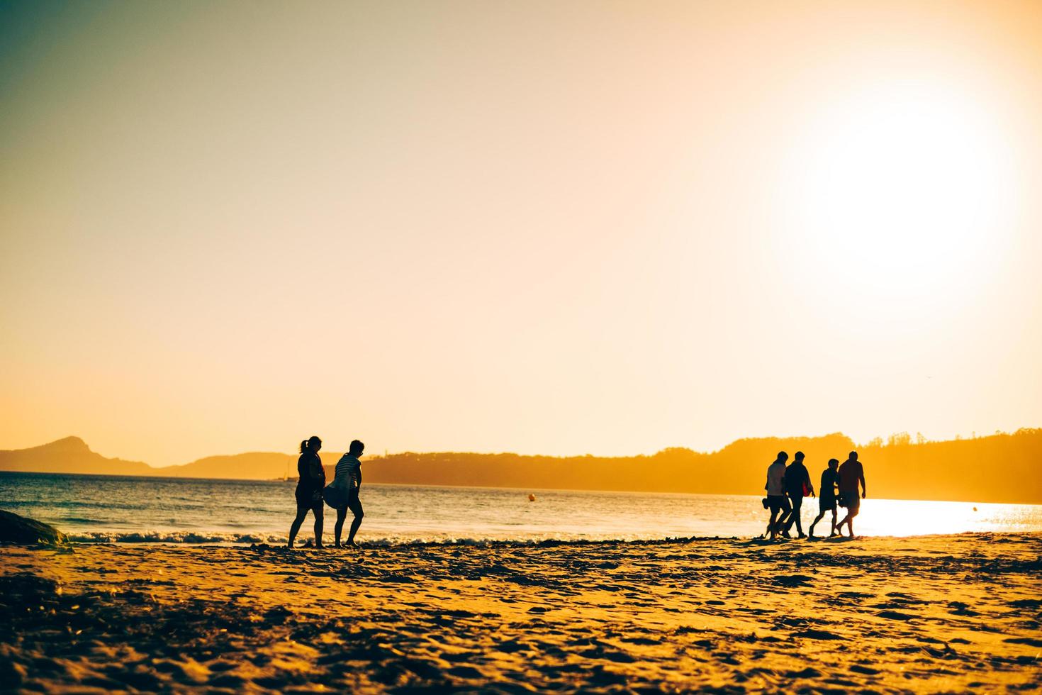 friends walking on the beach photo