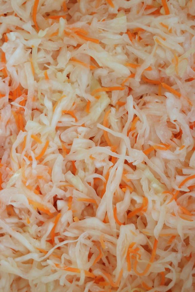shredded sauerkraut with carrots abstract background photo