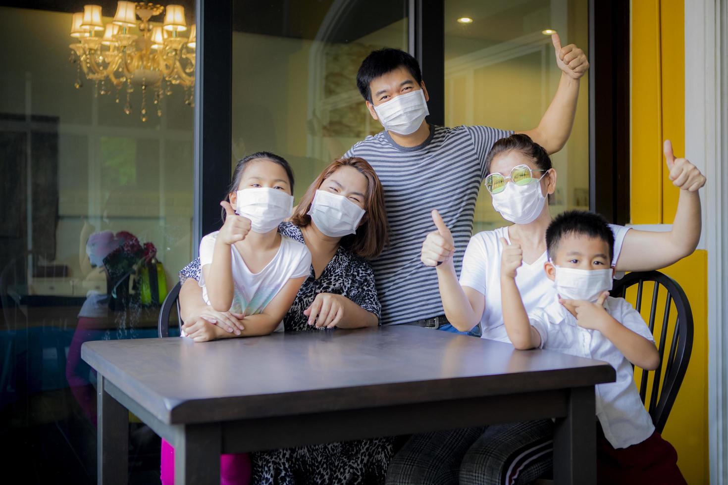 asian family quarantine at home while corona virus ,covid-19 infected period photo