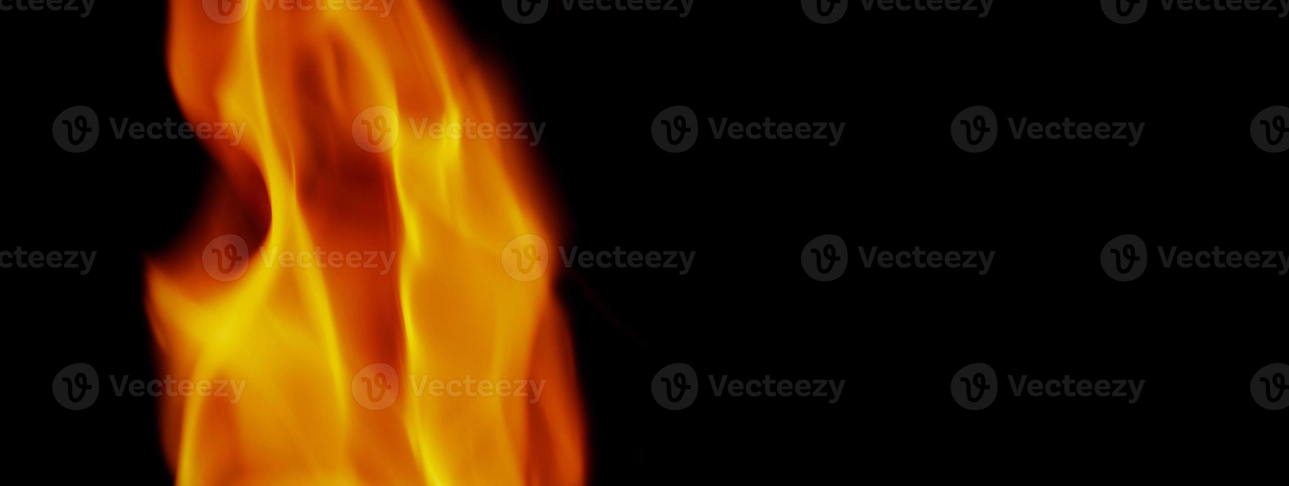 Fire background. Abstract burning flame and black background. photo