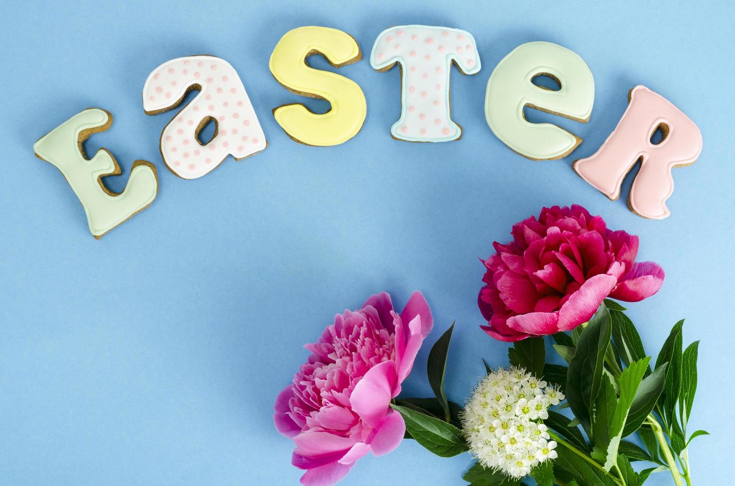 Easter composition, homemade cookies on bright background. photo