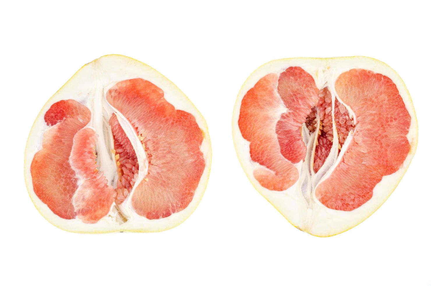 Halves of red chinese sliced pamelo on white background. photo