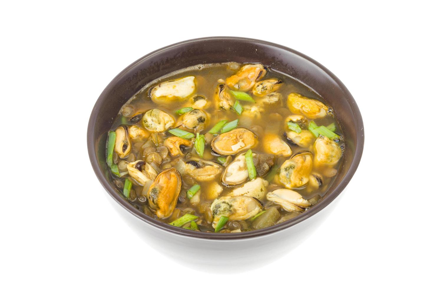 Hot spicy soup with mussels and vegetables photo