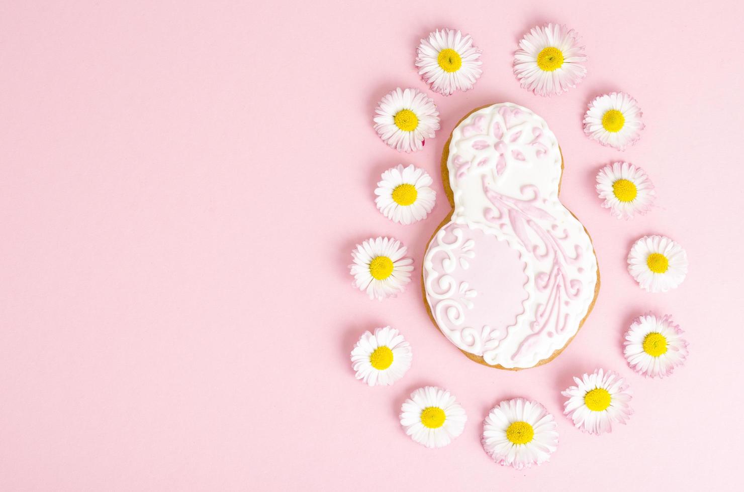 Figure eight homemade cakes and flowers on bright background. photo