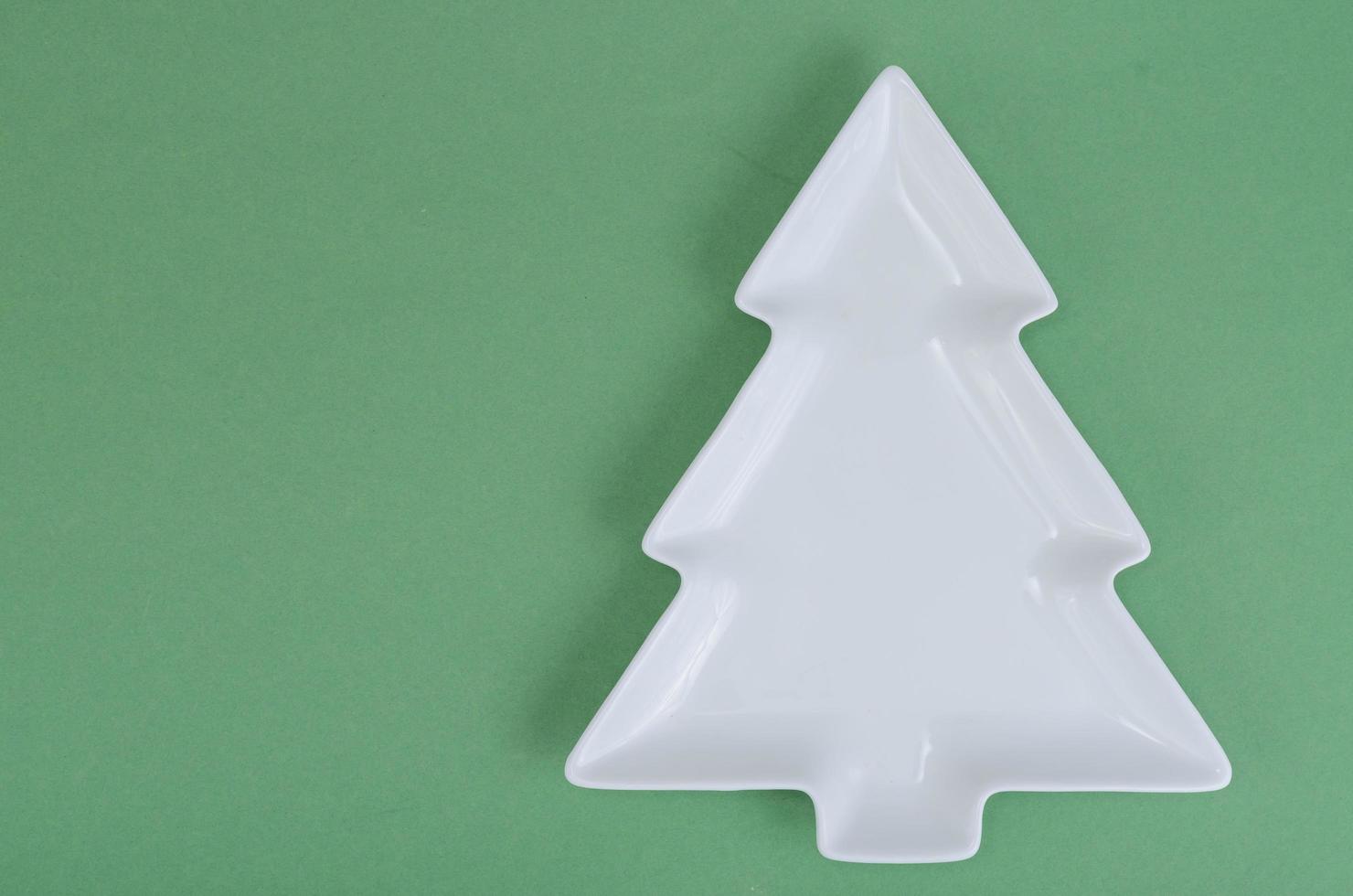 Empty white christmas tree plate for table Christmas festive setting. photo