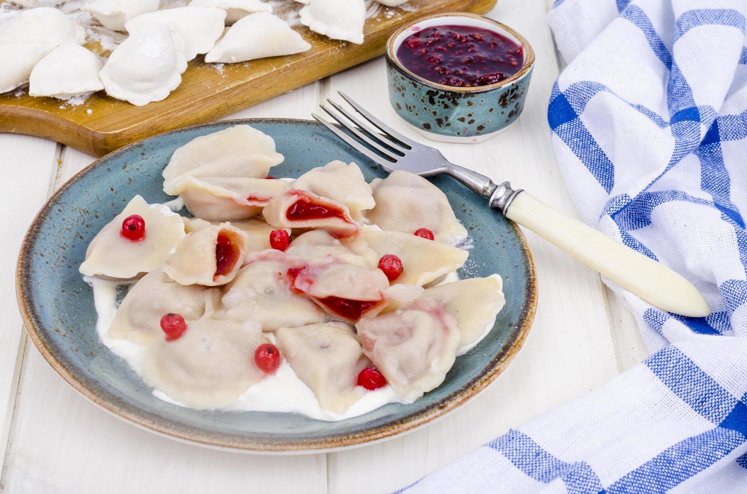 Dumplings with pastry stuffed with fresh berries. photo