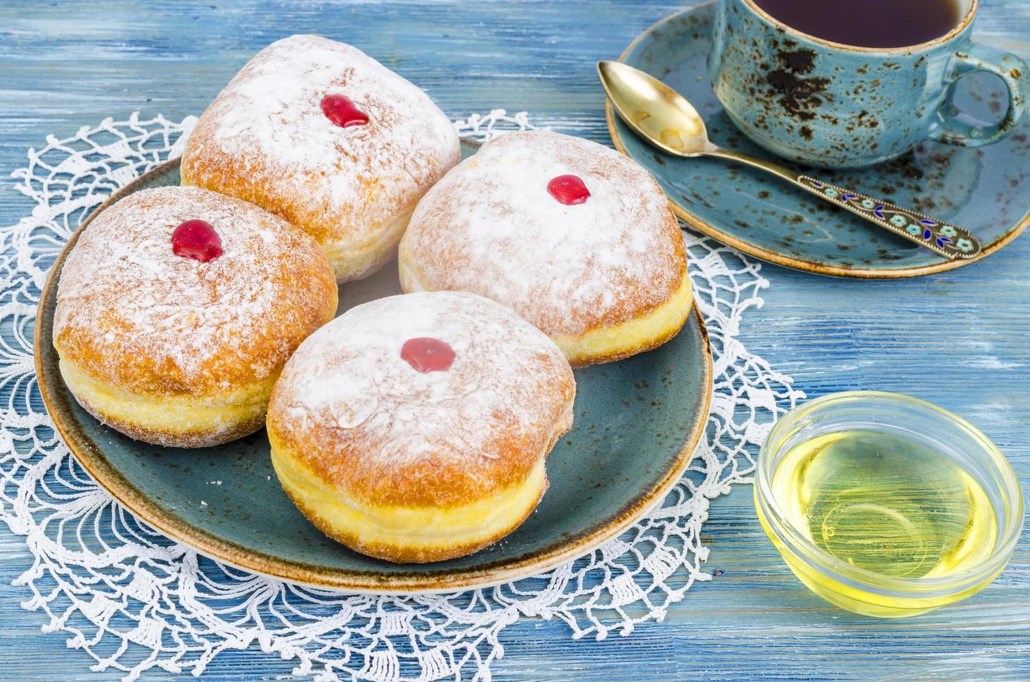 Traditional food doughnuts with icing sugar and jam. Concept and background Jewish holiday Hanukkah. photo