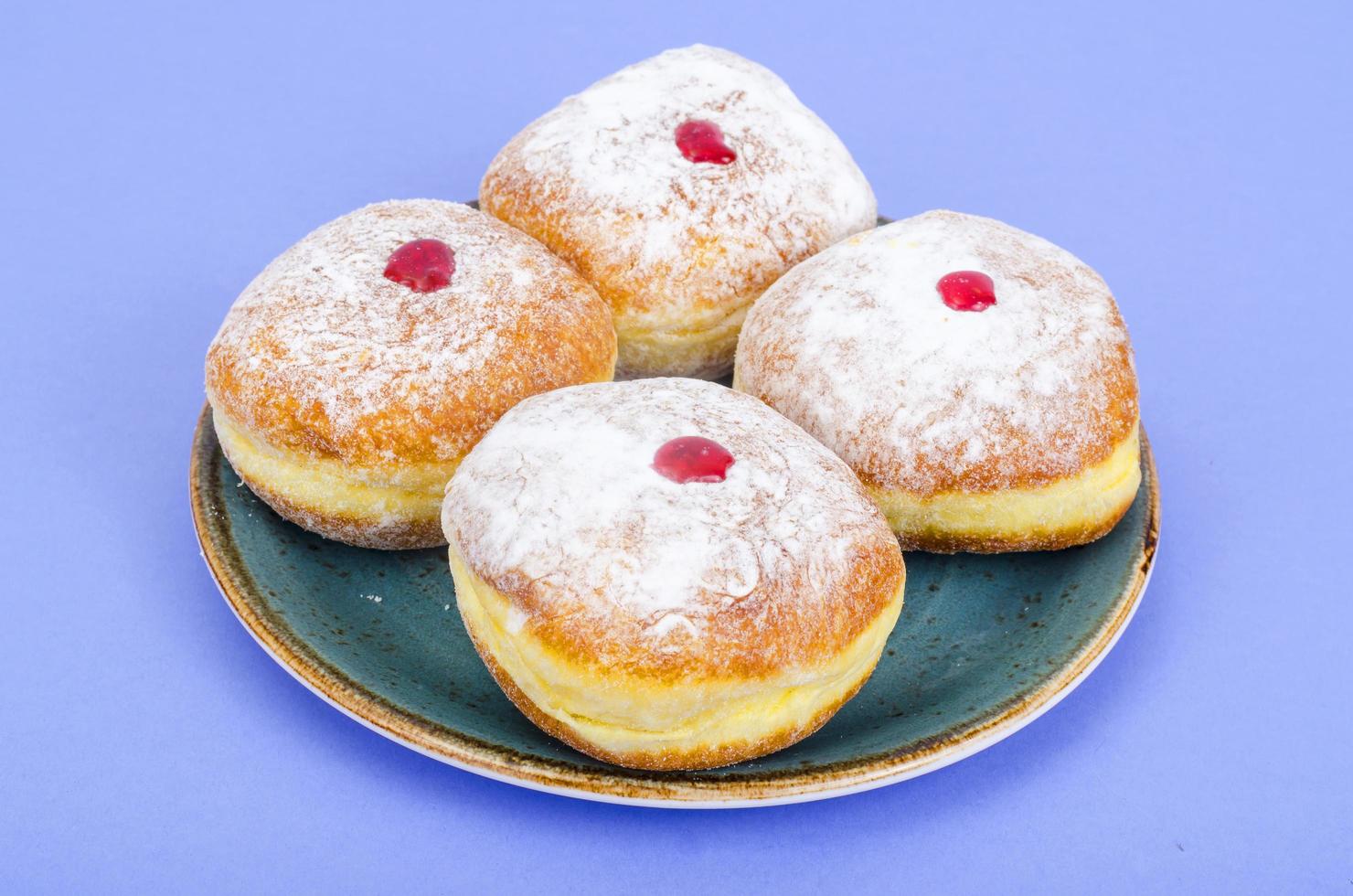 Traditional food doughnuts with icing sugar and jam. Concept and background Jewish holiday Hanukkah. photo
