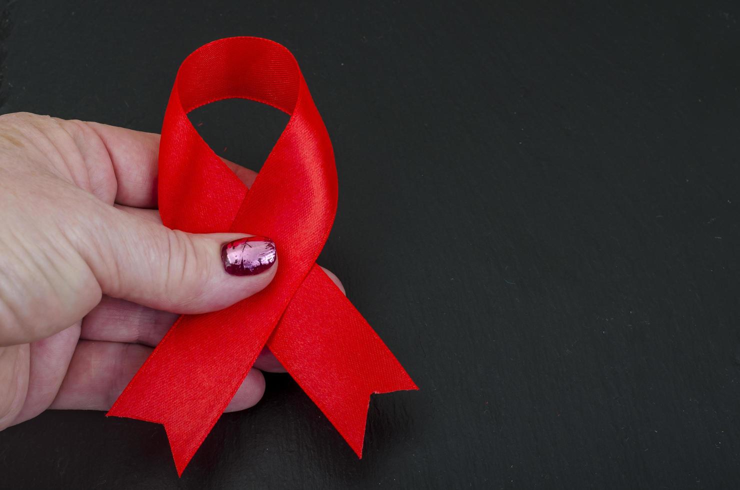 World AIDS Day, red ribbon, symbol. Studio Photo. photo