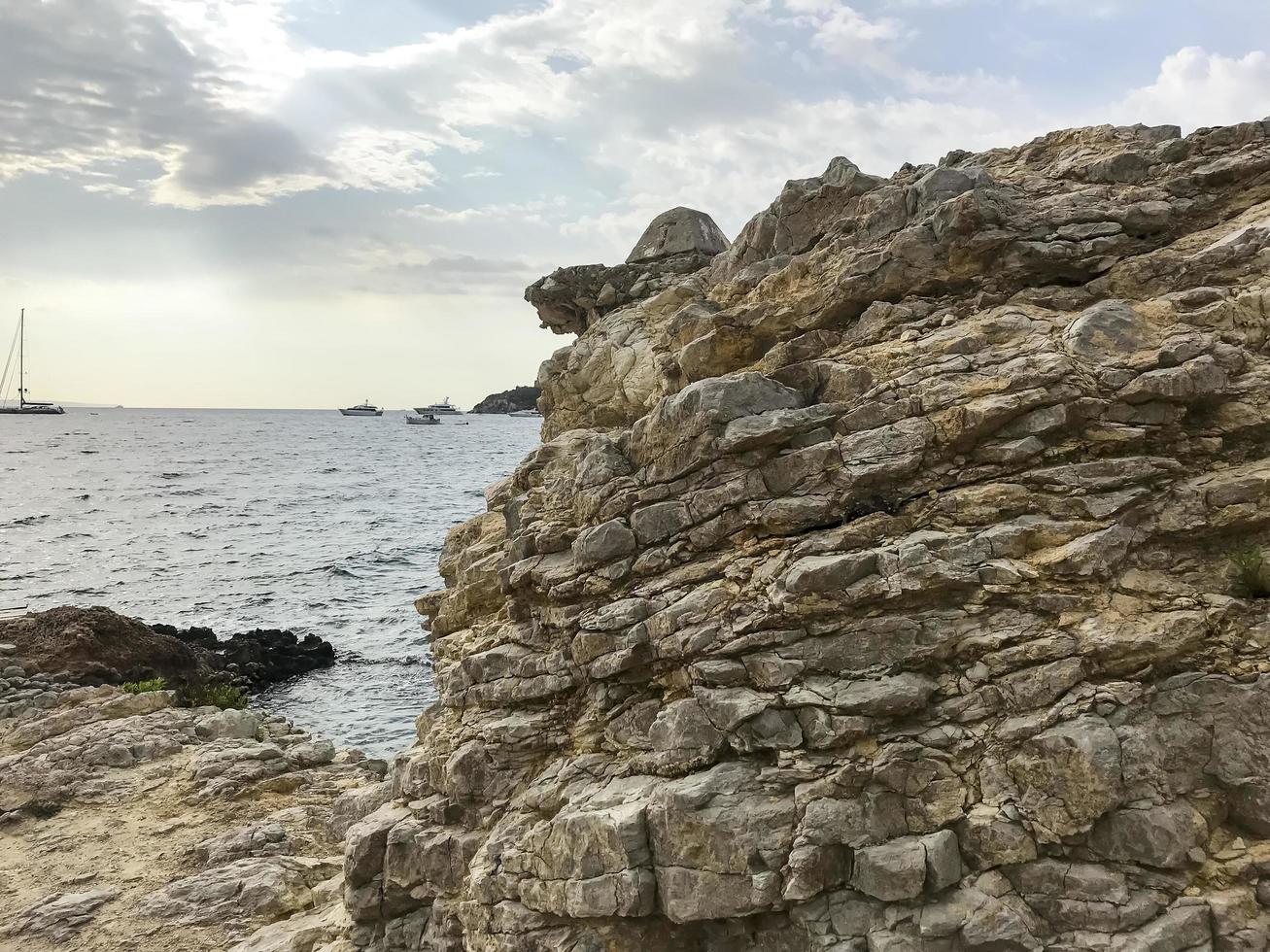 Geological rocks, sea stones on seashore. Photo