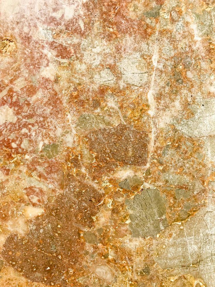 Fondo, textura de piedra natural de tono rosa. foto