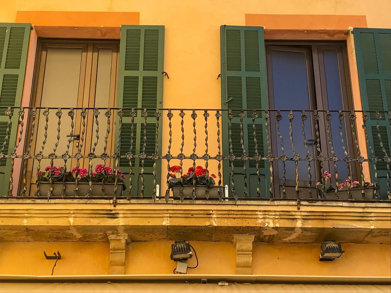 Flowering plants and potted flowers decorating building facades. photo