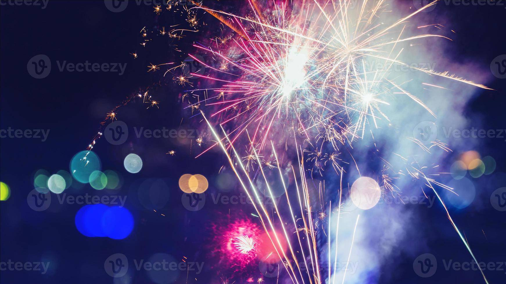 Abstract colorful fireworks for design banners, invitations and greeting cards. Background festive New Year with fireworks, Vector illustration. photo