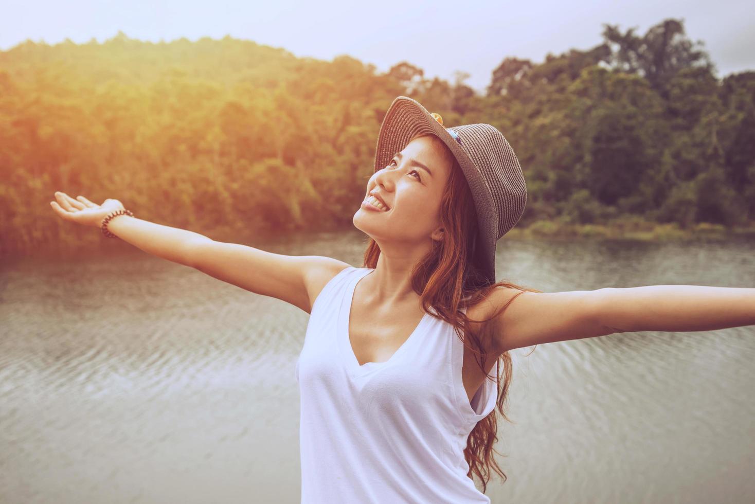 Asian women relax in the holiday. In the natural atmosphere, mountain forest. photo