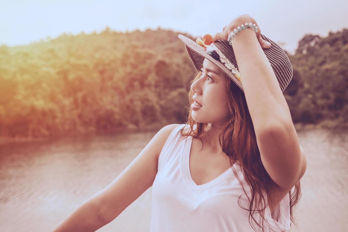 Asian women relax in the holiday. In the natural atmosphere, mountain forest. photo