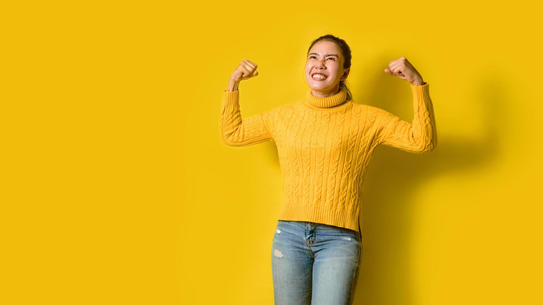 portrait of beautiful girls smiling happy wearing yellow standing set in the studio. Women who show strength. Good health photo