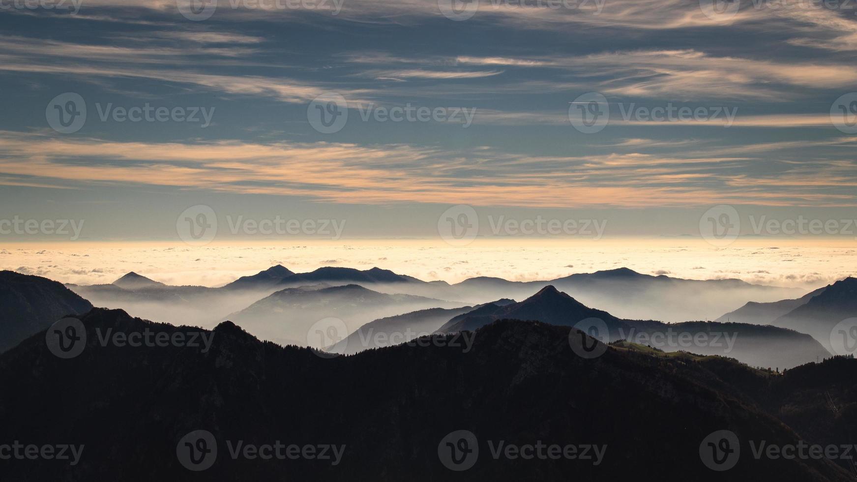 Mountain landscape shrouded in fog photo