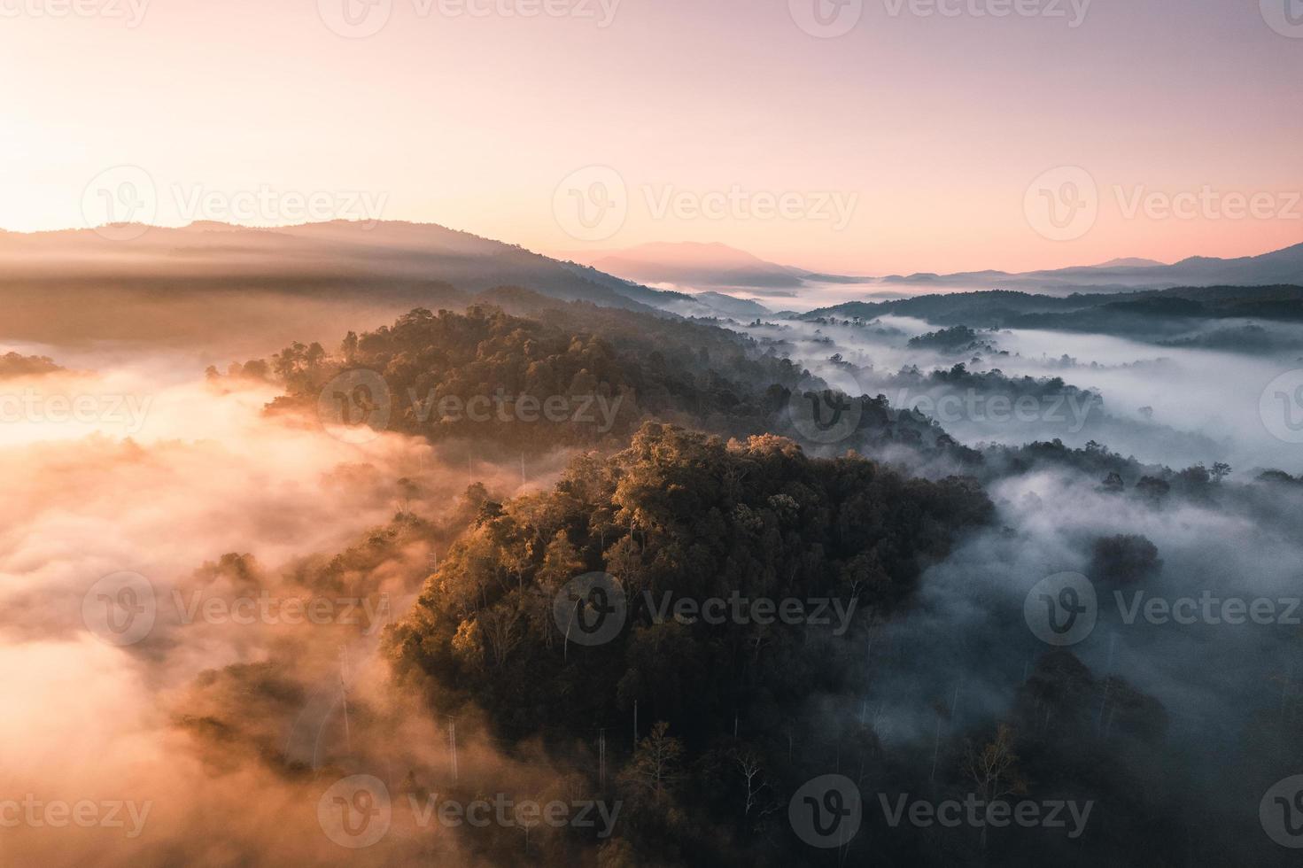 Flying above the clouds sunrise and fog photo