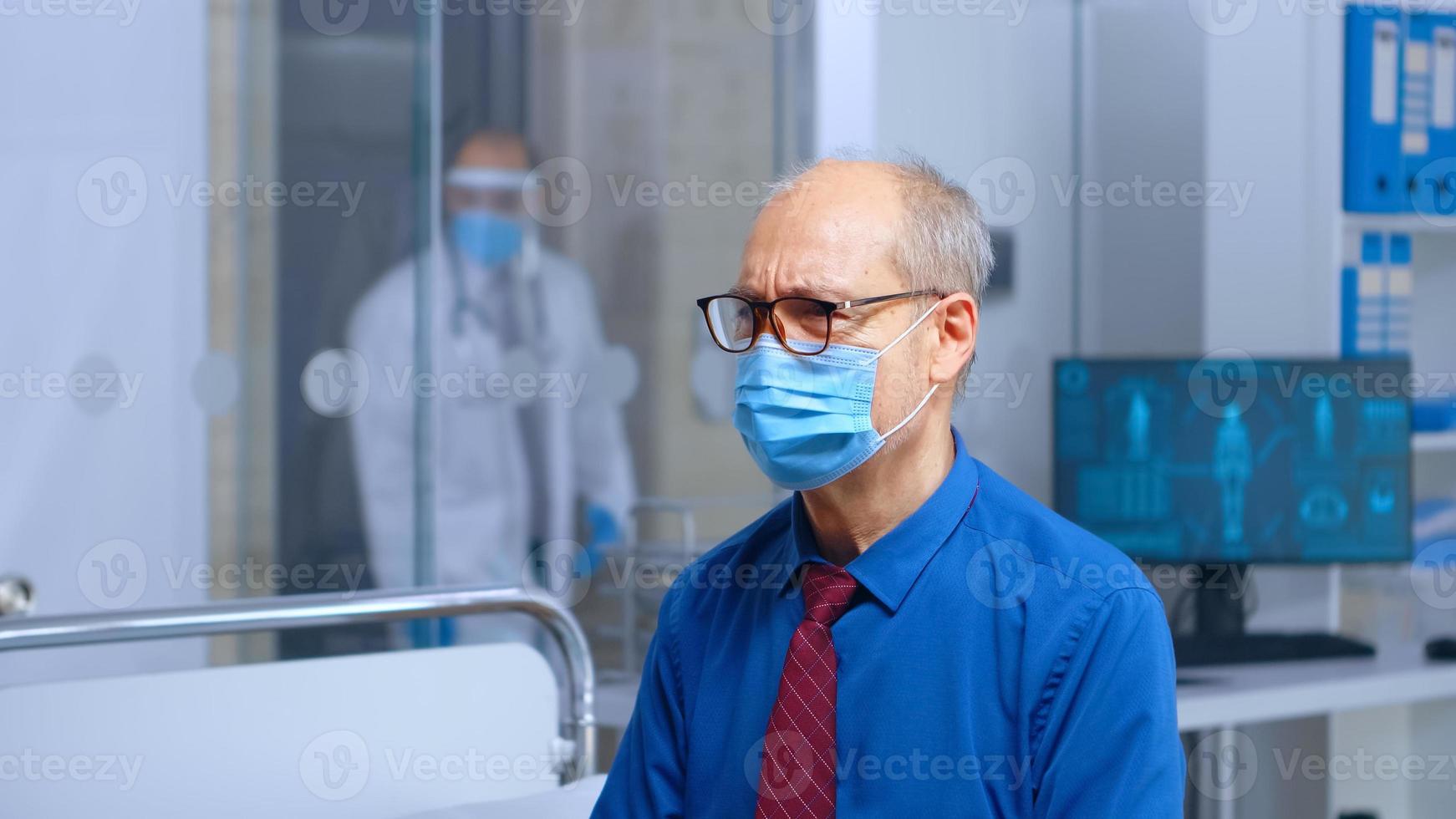 Worried senior patient with a mask photo