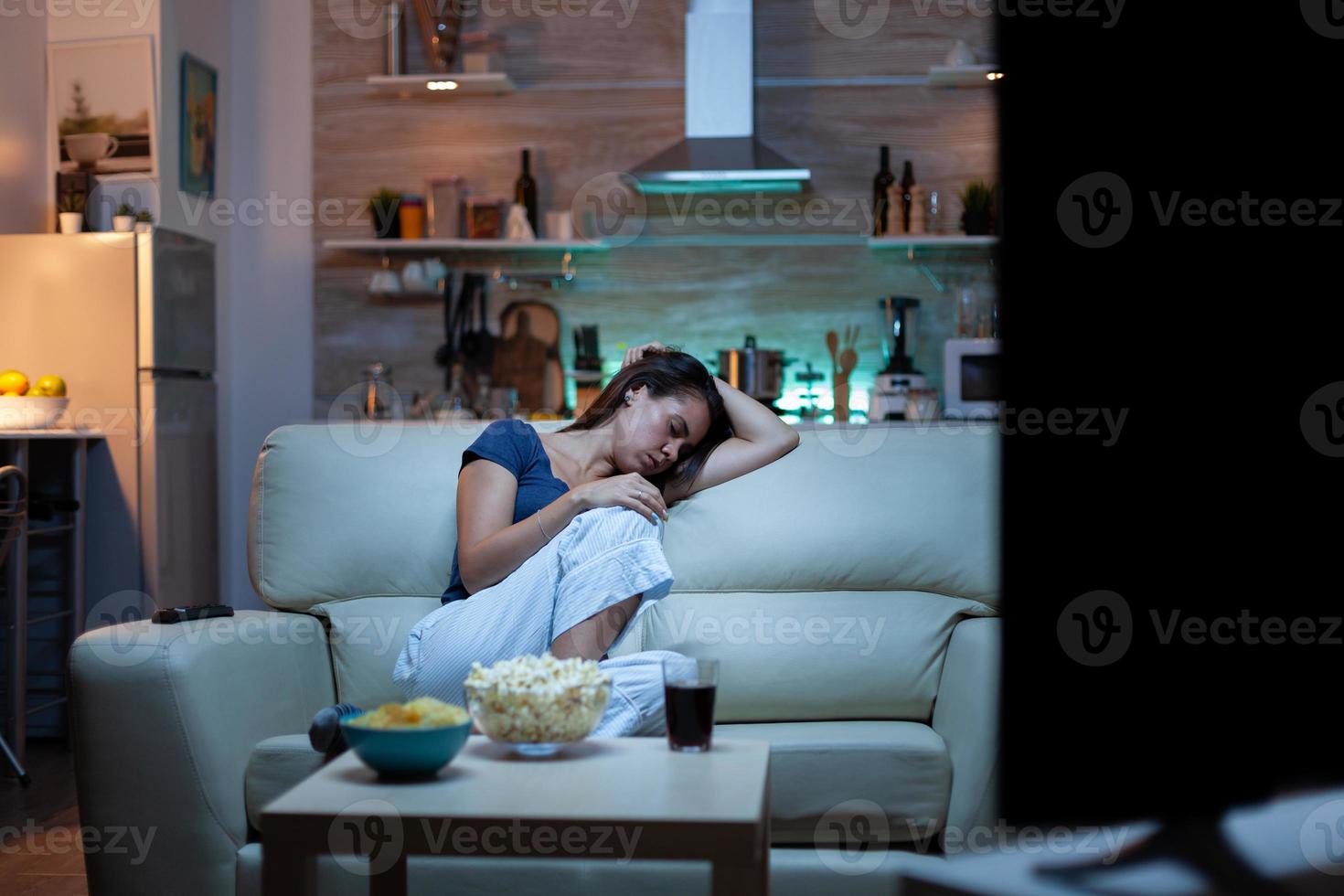 Housewife falling asleep in living room photo