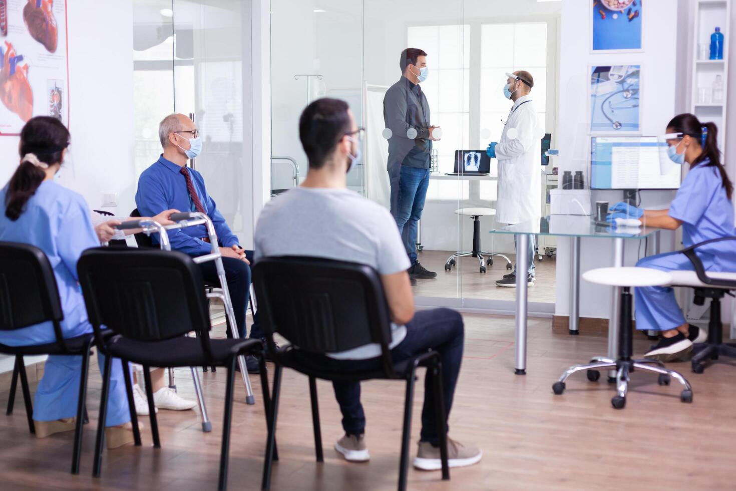 Man discussing with doctor photo