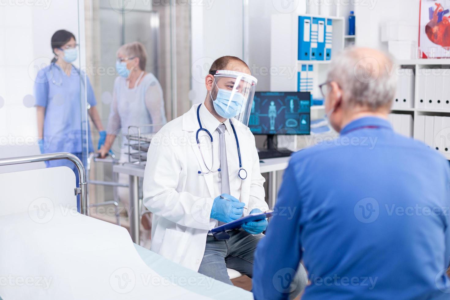 Doctor wearing visor photo