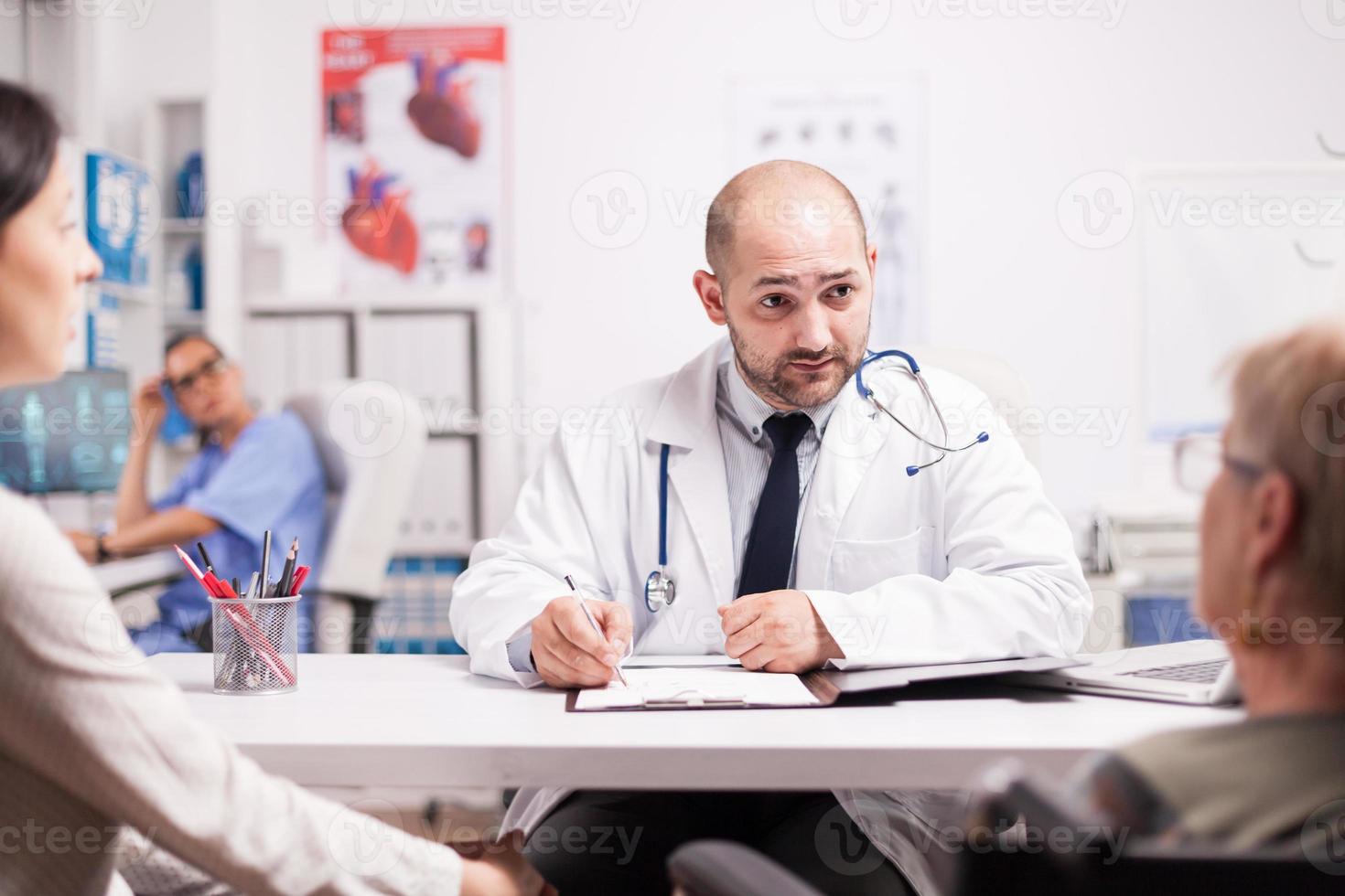 Doctor explaining illness photo