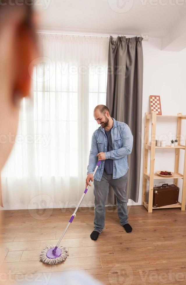 Laughing and cleaning floor photo