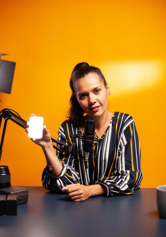 Content creator holding mini led photo