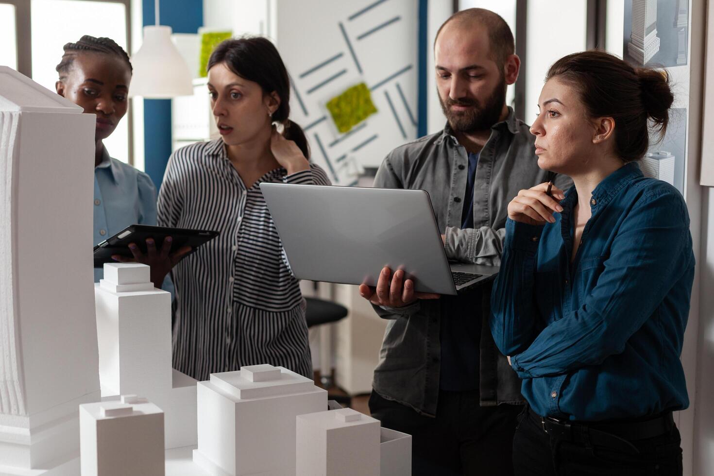 Architecture multi ethnic workers meeting at office photo