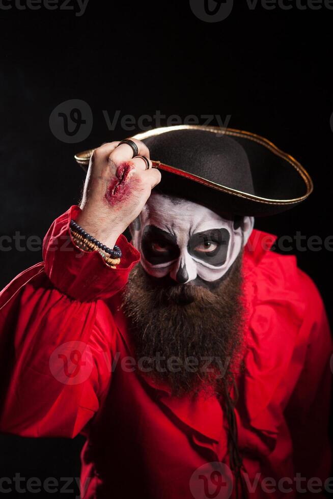 Spooky medieval pirate with hat saying hello photo