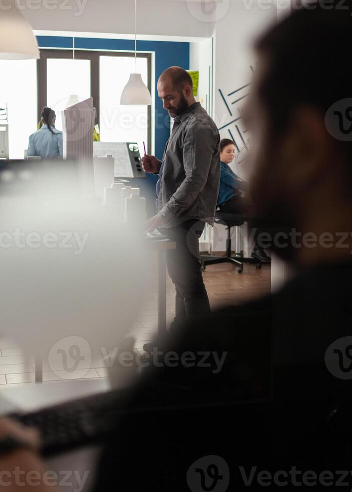 Architect profession man looking at layout construction photo