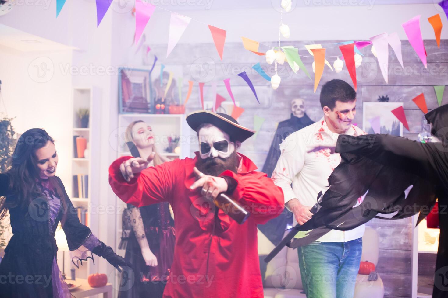 Man dressed up like pirate feeling good with his friends photo