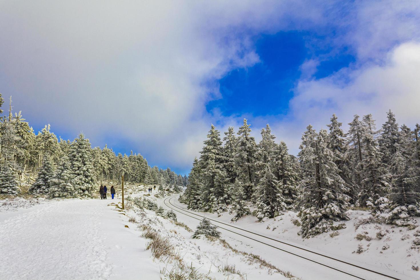 Brocken Germany 12. January 2014 Hikers people in snowed in landscape Brocken mountains Harz Germany. photo