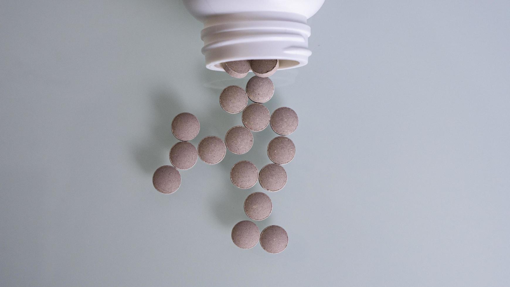 Pills Are Poured From A Bottle Of Pills photo