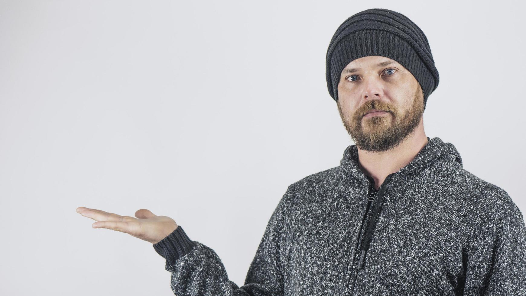 Guy Holds His Palm On A Blank White Background photo