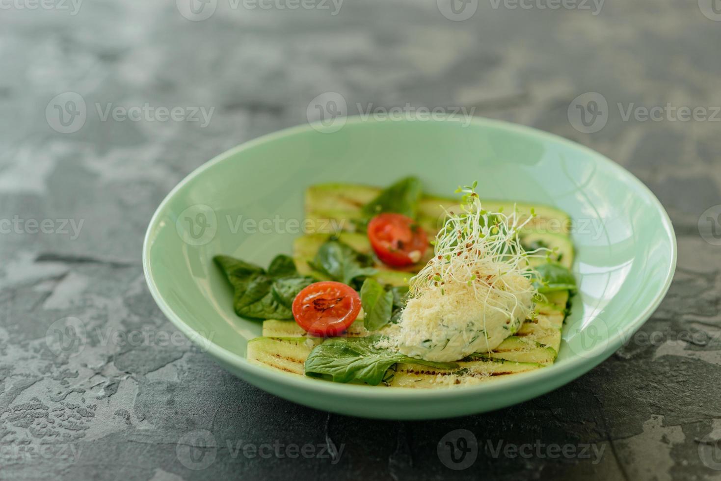 Salad from zucchini slices with cherry tomato, cream cheese photo