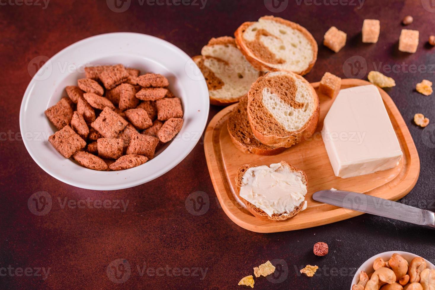 Tasty and nutritious breakfast with granola, cereals and nuts. Healthy food photo