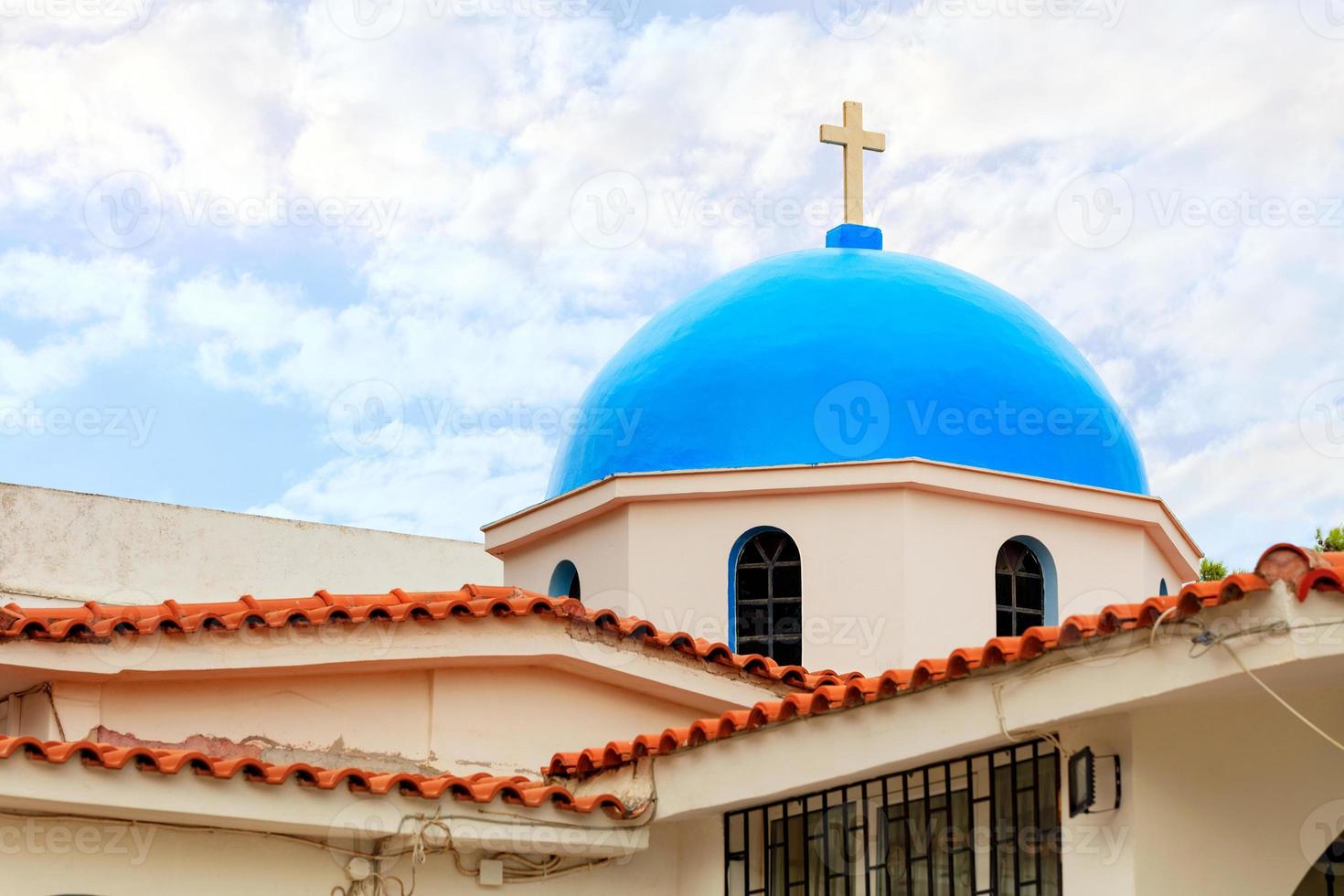 The blue dome of the traditional Greek bell tower of a Christian Orthodox temple in Loutraki, Greece. photo