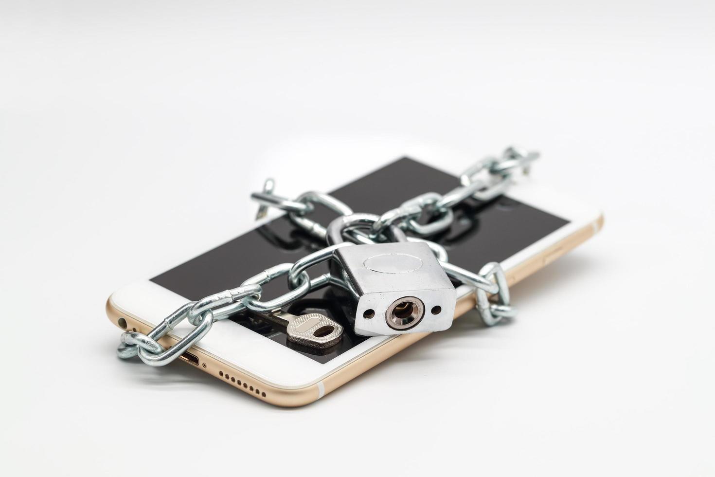 smart phone with chain lock and money isolated, idea for technology with security photo