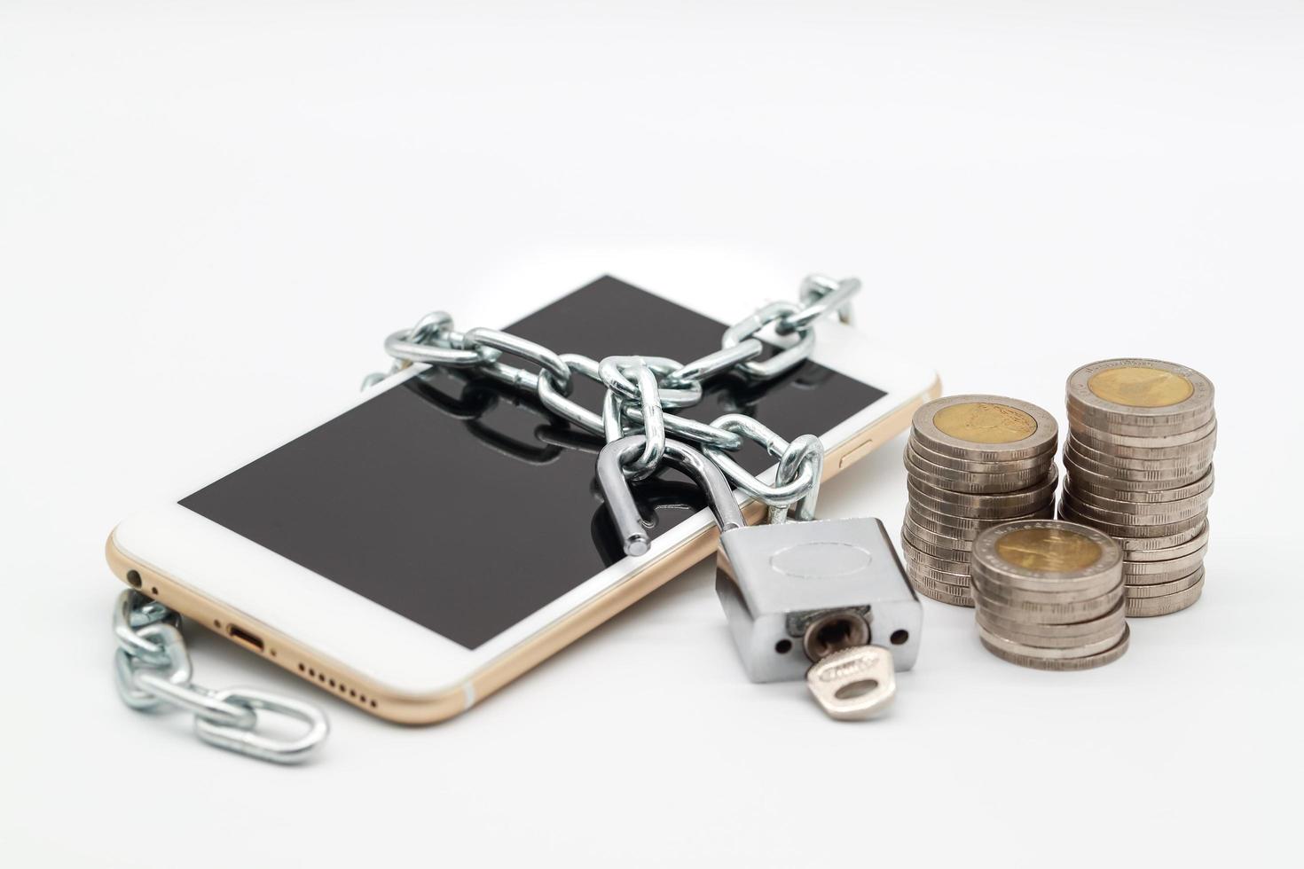 smart phone with chain unlock and money isolated, idea for technology with security photo