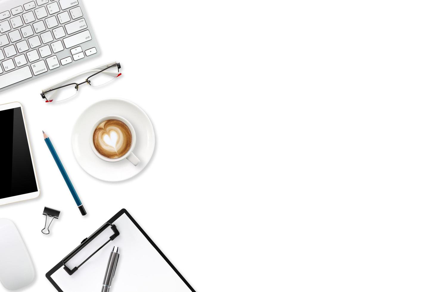 technology working table with laptop computer, office supplies, coffee cup and cell phone isolated and white background photo