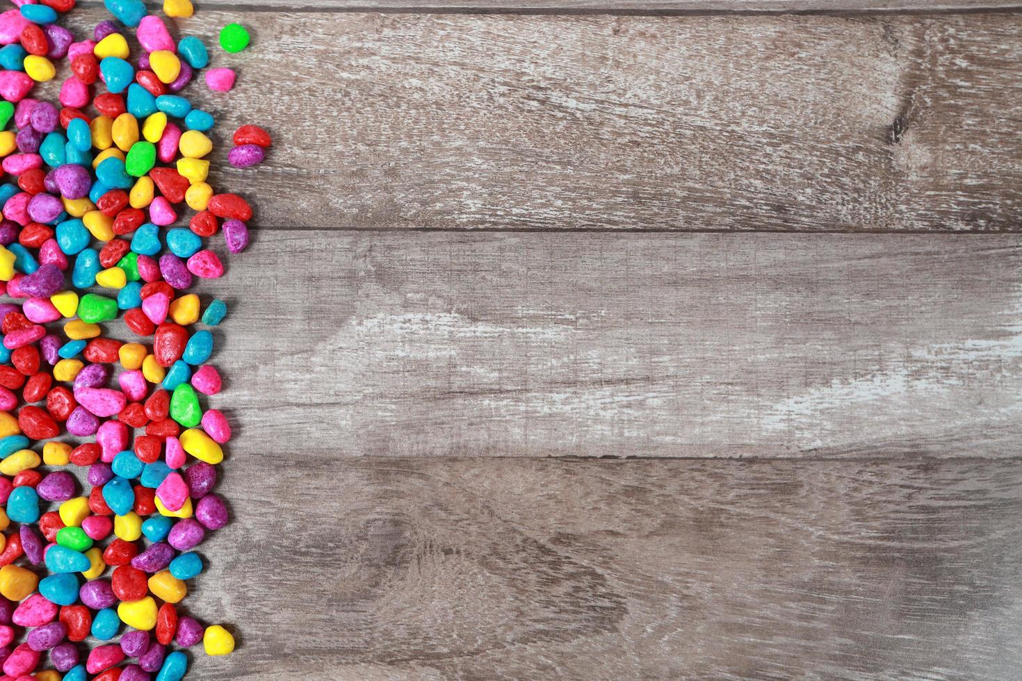 colorful rock on wood desk using as background photo